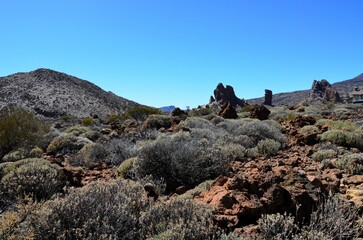 Scenic view of volcanic rock formations in desert during sunny day, Teide National Park, Tenerife