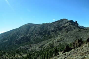 Scenic view of volcanic rock formations in desert during sunny day, Teide National Park, Tenerife