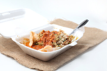 Indonesian Rice Porridge ( Bubur Ayam ) with Shredded Chicken, cakwe. crackers, in styrofoam container