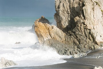 Heavy Waves Crashing on the white rock at new zealands coast