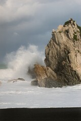 Heavy Waves Crashing on the white rock at new zealands coast