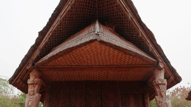 artistic rural tribe traditional home made of bamboo twigs and mud at village at day