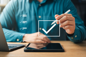 Performance checklist and tracking business performance, businessman using pen to mark checkboxes,...