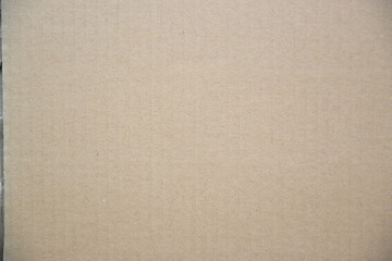 Brown background of paper texture or cardboard surface from a paper box There are wrinkles from the impact. Surface of the parcel box is wrinkled with Transport