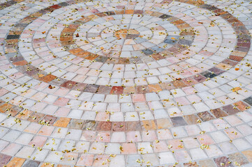 Ornate pebble pattern. The background is made of smooth stone. The texture of the paving is made of...