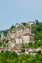 Obraz premium View of the city of Rocamadour Lot Occitanie in Southern France in summer. The city was built on a rock above the river Alzou and founded in the early middle ages by the hermit Amadour.
