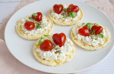 corn cake with cream cheese and Cherry tomatoes shaped of heart