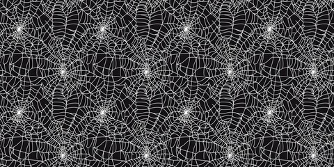 Seamless spider web pattern with a spooky, intricate design. seamless background pattern