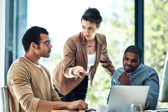 Manager, office and business people on laptop in discussion for planning, teamwork and project ideas. Corporate company, collaboration and men and women talking for feedback, review and meeting