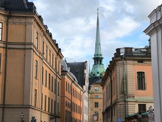 A street lined with colorful houses in Stockholm's historic Gamla Stan district, Sweden