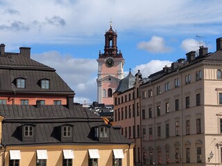 A street lined with colorful houses in Stockholm's historic Gamla Stan district, Sweden