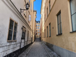 A street lined with colorful houses in Stockholm's historic Gamla Stan district, Sweden