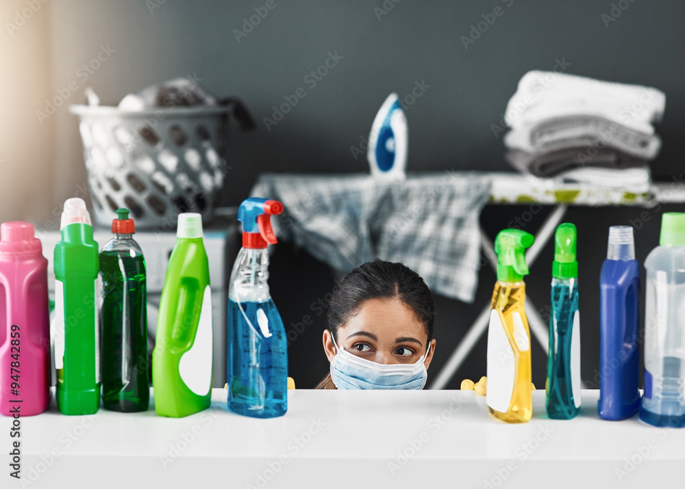 Wall mural Thinking, woman and cleaning product spray for housekeeping, hygiene or chemical liquid. Chores, bottle and choice of detergent for housework decision with mask for mpox prevention on table in home