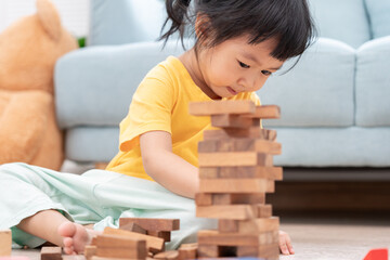 Happy Asian child playing and learning toy blocks. children are very happy and excited at home....