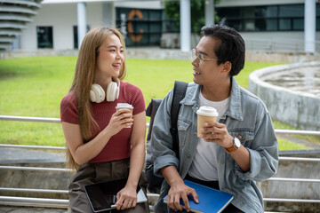A beautiful, happy young Asian female college student is enjoying a conversation with her male friend while walking outdoors