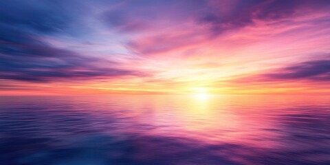 Fototapeta premium A dramatic horizon background featuring a sunset with vibrant colors blending into the horizon and reflecting on a gentle landscape.