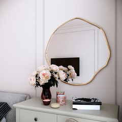 Render of bedroom vanity corner with organic circle shaped mirror, beige vanity desk and beige armchair.