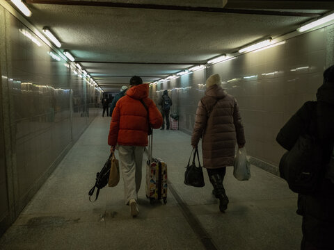 people walking on the underpass of the Przemyśl station at night