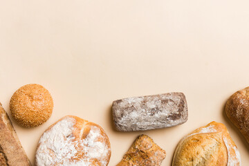 Homemade natural breads. Different kinds of fresh bread as background, top view with copy space