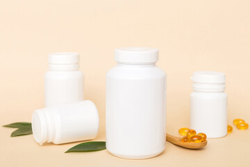 Omega-3 capsules lie in white bottle on a table with green leaves background. Fish oil tablets. Biologically active additives. omega 6, omega 9, vitamin A, E, D, vitamin D3 top view with copy space