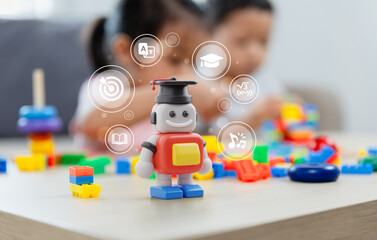 Closeup on a red AI robot toy that wearing a graduation cap that means technology of AI artificial intelligence tool for the student's learning