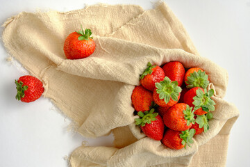 red ripe strawberries on a white background