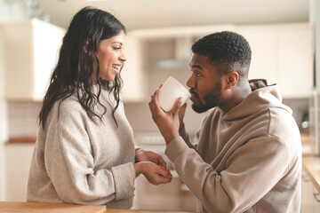 Cozy Morning Moments Over Warm Drinks in a Modern Kitchen