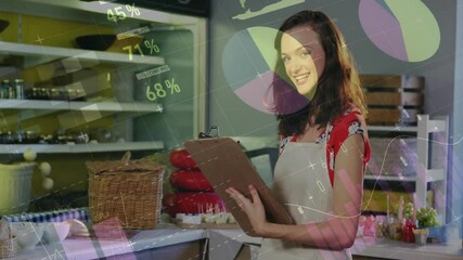 Smiling woman holding clipboard in bakery with data visualization animation over - Powered by Adobe