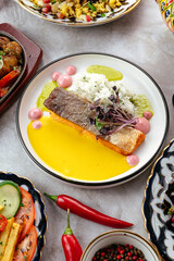 fried salmon with sauce on a plate