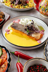 fried salmon with sauce on a plate