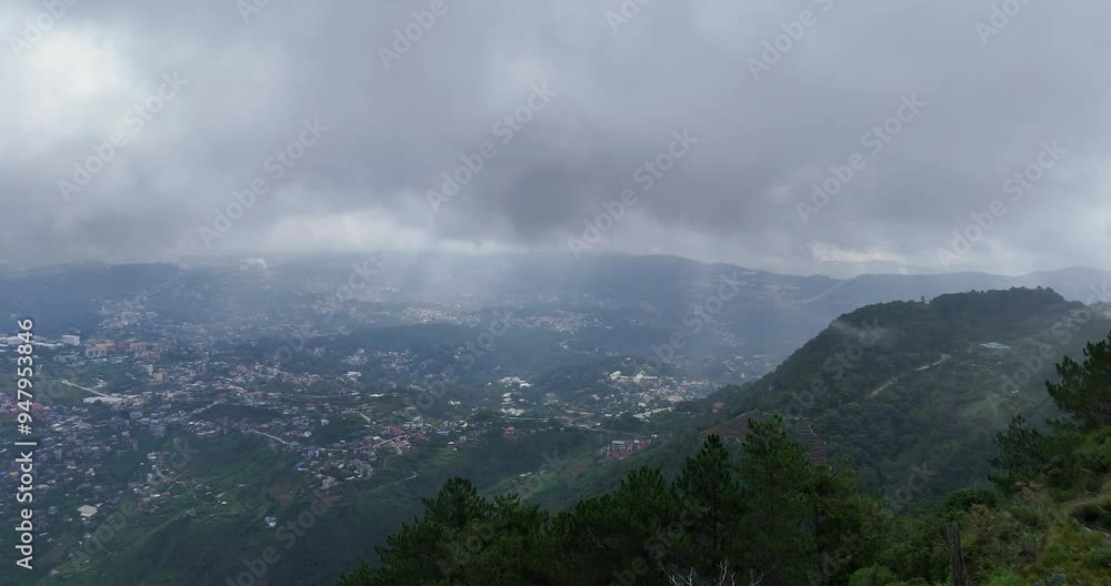 Poster a captivating cinematic image capturing a mountain range shrouded in foggy clouds moving along the m