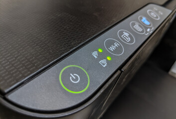 a photo of the on, off and other setting buttons on the printer.Control buttons for the ink jet...