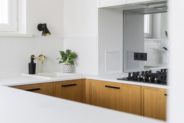 Modern kitchen design featuring elegant cabinetry and white counter top
