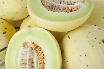 Fresh ripe honeydew melons as background, closeup