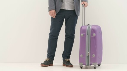 Traveling business man tourist with suitcase in international airport standing waiting for flight, isolated on white background. Travel concept.