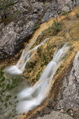 Small waterfall captured with long exposure. View of the waterfall taken from the top. Waterfall photo taken with long exposure technique. Nallıhan Ankara, Türkiye.