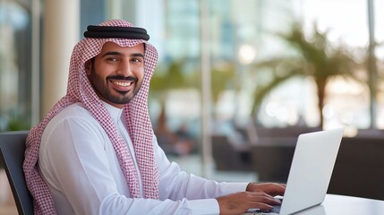Arab businessman using a laptop