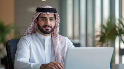 Arab businessman using a laptop
