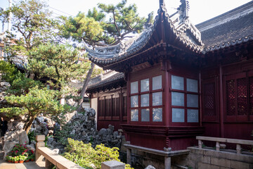 Traditional Chinese Architecture in a Tranquil Garden Setting Showcases Intricate Design Details in the Heart of a Historic Location