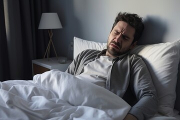 Fototapeta premium Sick man in bed.