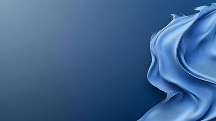 Fototapeta premium Elegant blue fabric flowing against a dark background, evoking a sense of calmness and sophistication.