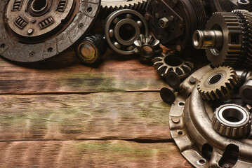 Car spare parts on the wooden workbench background. Top view.