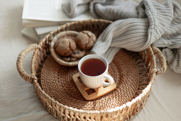 Home coziness composition with a cup of tea. Autumn home comfort.