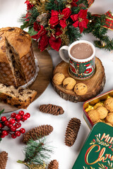 Christmas panettone and cup of hot chocolate with cookies on a white background