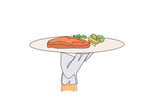 orange steak on plate held by hand clip art preview