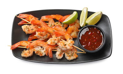 Delicious grilled shrimp skewers with sauce and lime isolated on white, top view