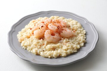 Delicious risotto with shrimps and cheese on white table, closeup