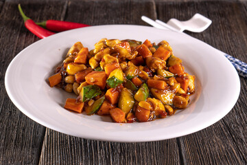 Chinese vegetables with beans on a wooden background. Food concept. Chinese food.