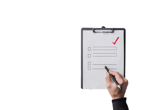 a hand holding a pen over a clipboard