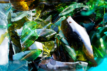 Broken glass bottles, background, texture. Broken glass bottles for recycling. Background of broken...